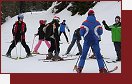 Dolomity, Latemar, lyžařský instruktor se svými svěřenci