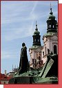 Ped Ministerstvem pro mstn rozvoj psn ke pod oboj o patnch mravech Mistr Jan Hus a za nm stoj katolick chrm Svatho Mikule 