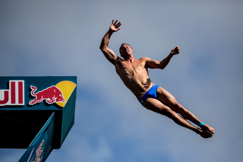 Michal Navrátil. Cliff diving Blue Lagoon Wales.